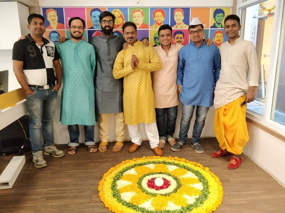 Fun at Dreamscape: the team dressed up for Diwali around a rangoli
